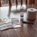 Photo of supplies needed to make seed tape. Carrot seeds, washable glue, toilet paper, permanent marker