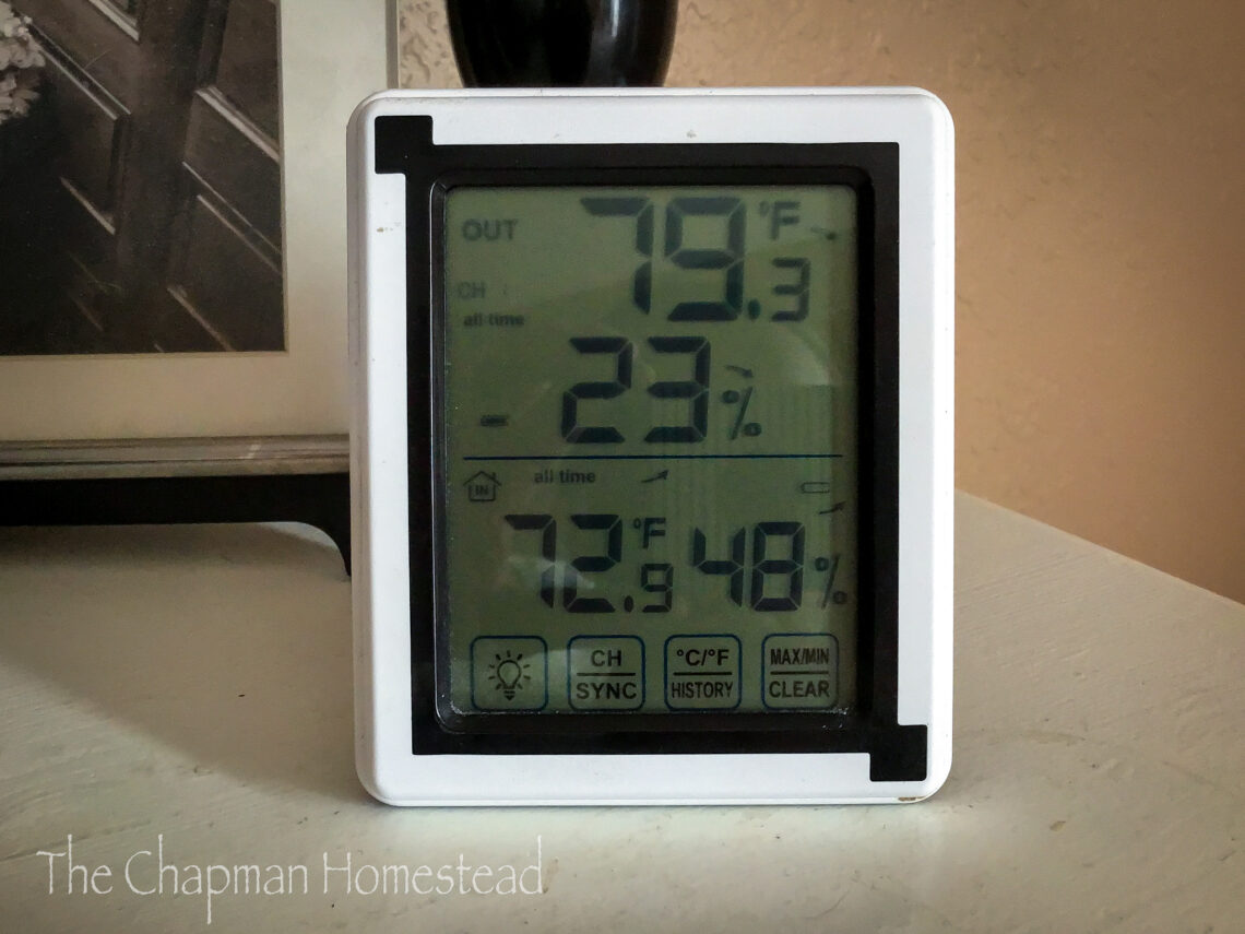 Photo of a digital thermometer receiver showing the outdoor and indoor temperature