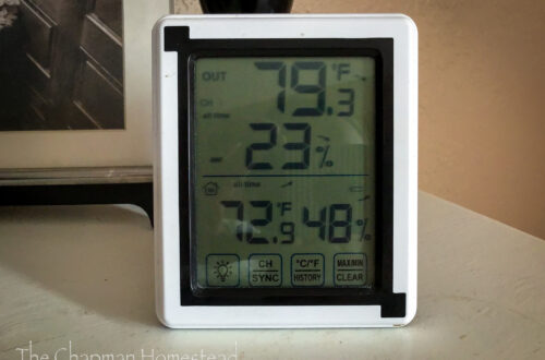 Photo of a digital thermometer receiver showing the outdoor and indoor temperature